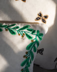 Embroidered border mistletoe pillow, cream cotton velvet