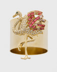 A decorative napkin ring featuring a gold-colored flamingo with pink and clear accents.