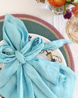 Bright stripe hand beaded placemat, aqua with lilac