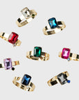 Gold napkin rings with colorful gemstones