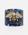 Stripey bee resin napkin rings, blue tortoiseshell, set of four