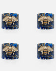 Stripey bee resin napkin rings, blue tortoiseshell, set of four