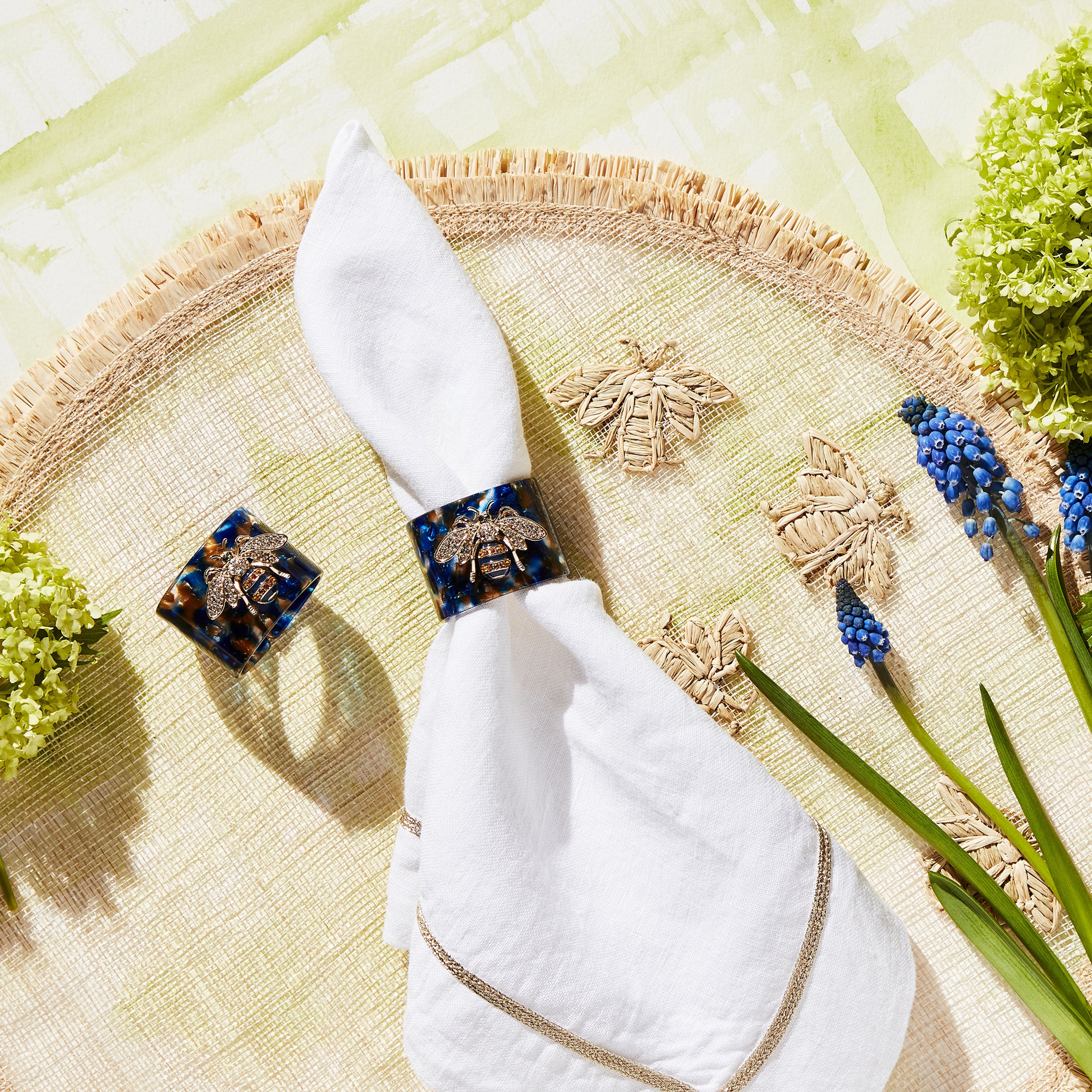 Stripey bee resin napkin rings, blue tortoiseshell, set of four