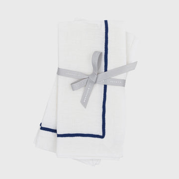 Navy trim linen dinner napkins, white, set of two