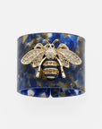 Stripey bee resin napkin rings, blue tortoiseshell, set of four