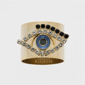 A gold-colored napkin ring featuring an evil eye design with blue and black accents.