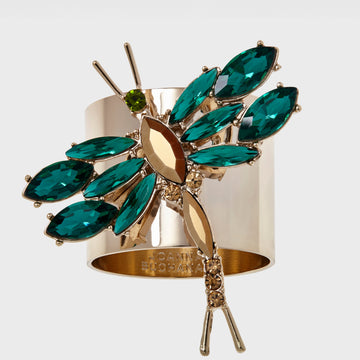 A napkin ring featuring a dragonfly design with green and gold colors.