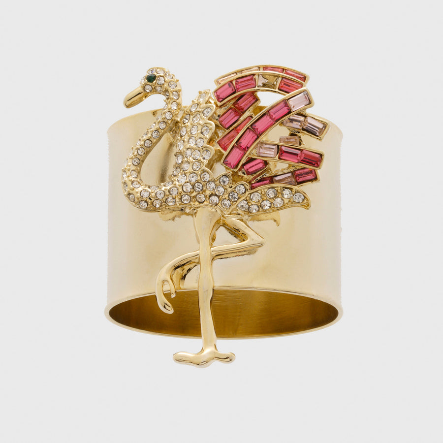 A decorative napkin ring featuring a gold-colored flamingo with pink and clear accents.