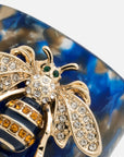 Stripey bee resin napkin rings, blue tortoiseshell, set of four