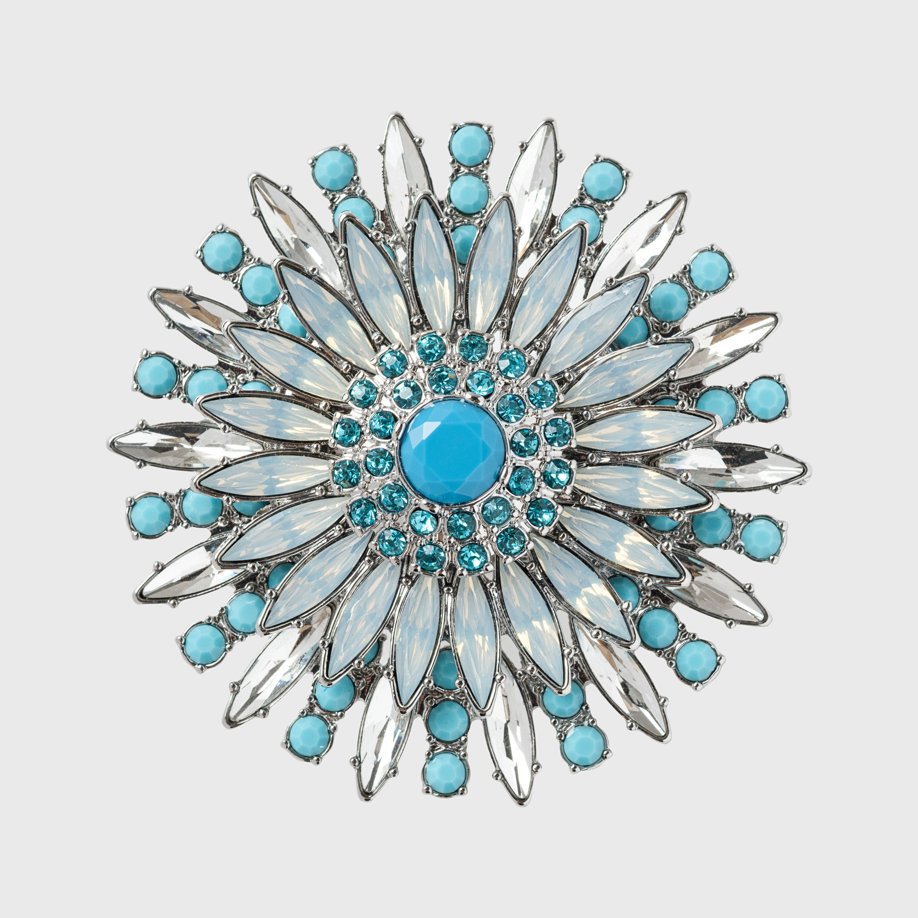 A turquoise and clear crystal flower-shaped napkin ring.