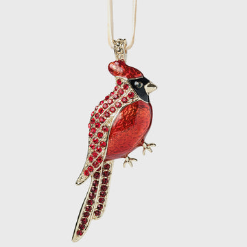 Red bird-shaped pendant with gold accents on a white background