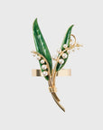 Gold napkin ring with green leaves and pearl-like beads 