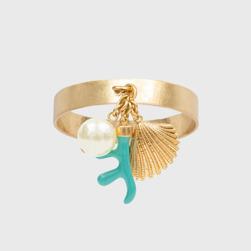 A gold-colored napkin ring featuring coral, pearl and shell charms with turquoise and gold details.