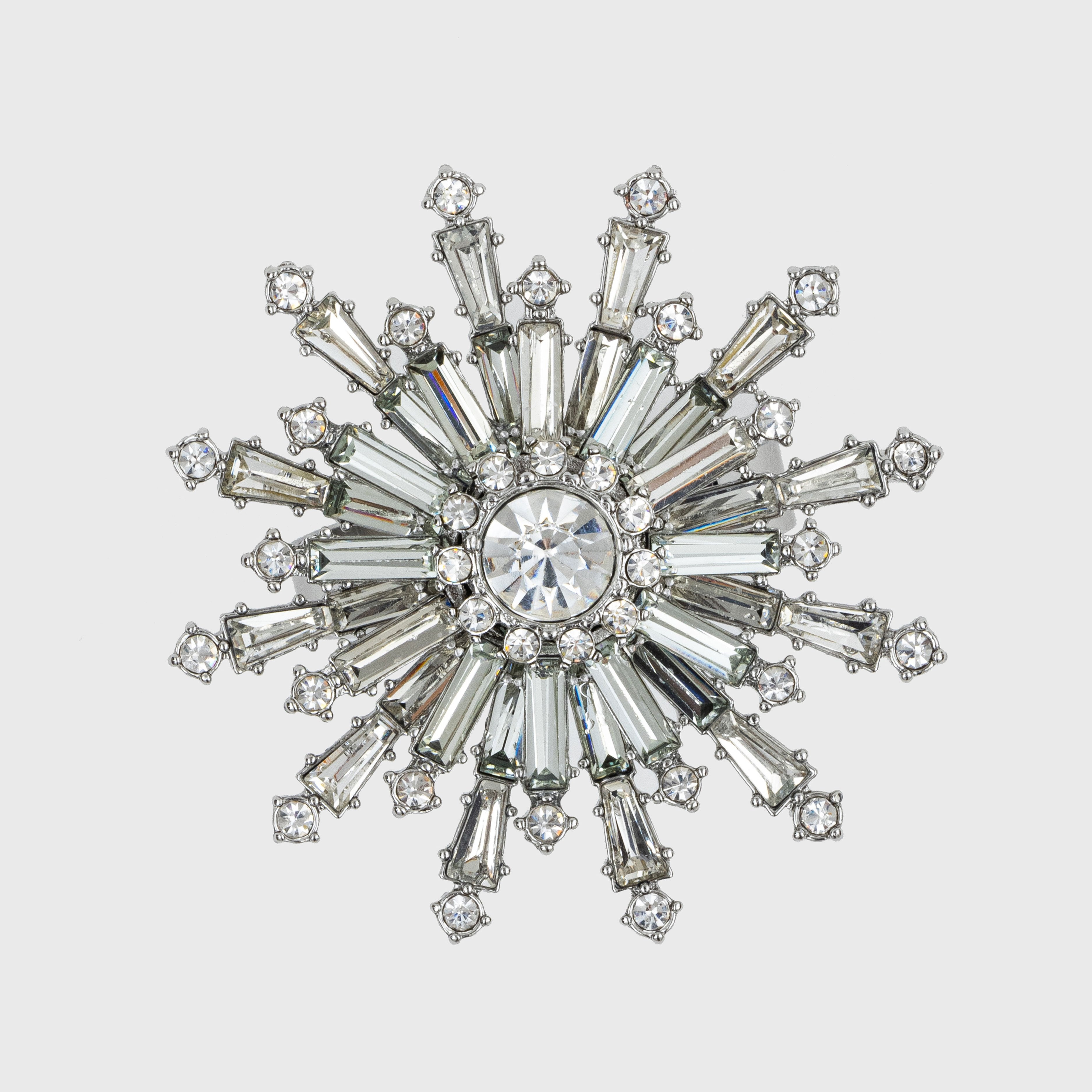 A clear crystal snowflake napkin ring with intricate detailing and sparkle.