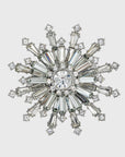 A clear crystal snowflake napkin ring with intricate detailing and sparkle.