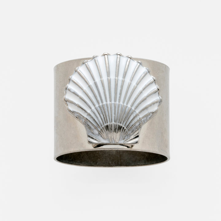 A silver-colored napkin ring featuring a painted shell design in white.