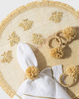 Straw pompom napkin rings, natural, set of four